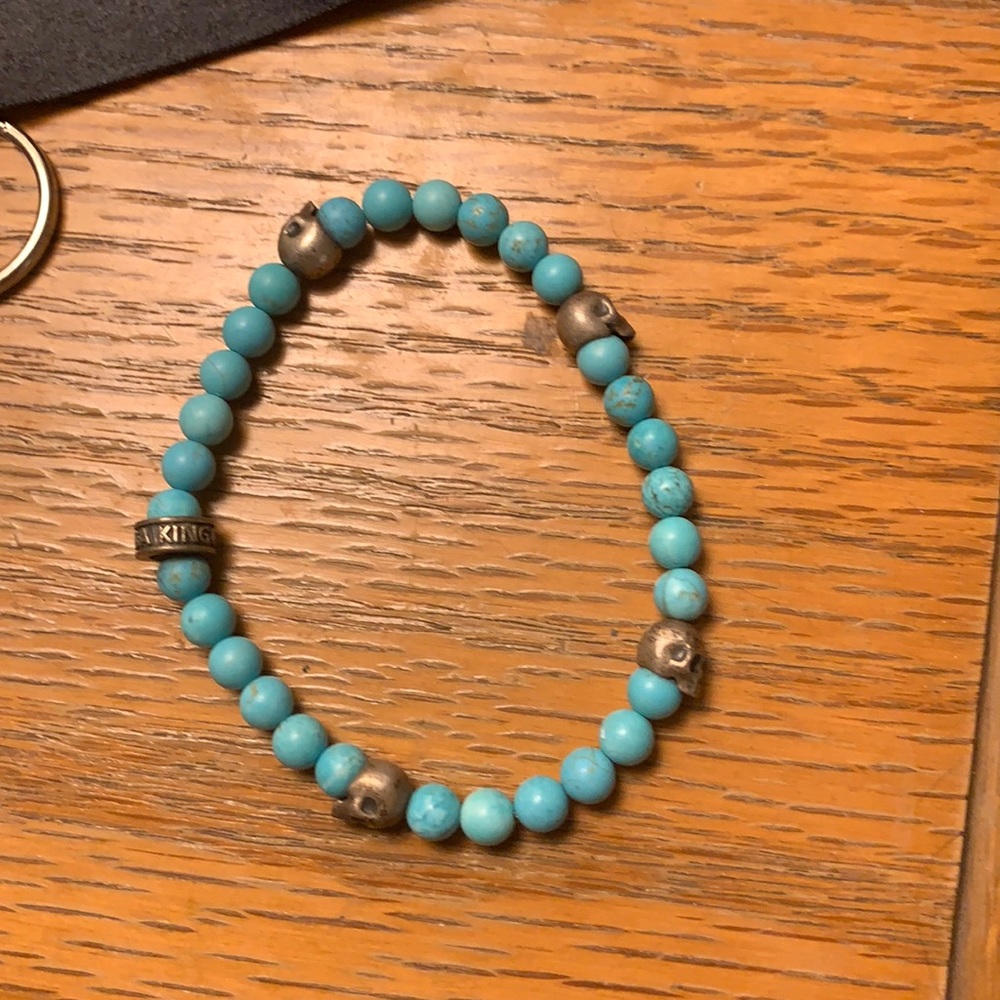 King baby bracelet - silver skulls and logo ring